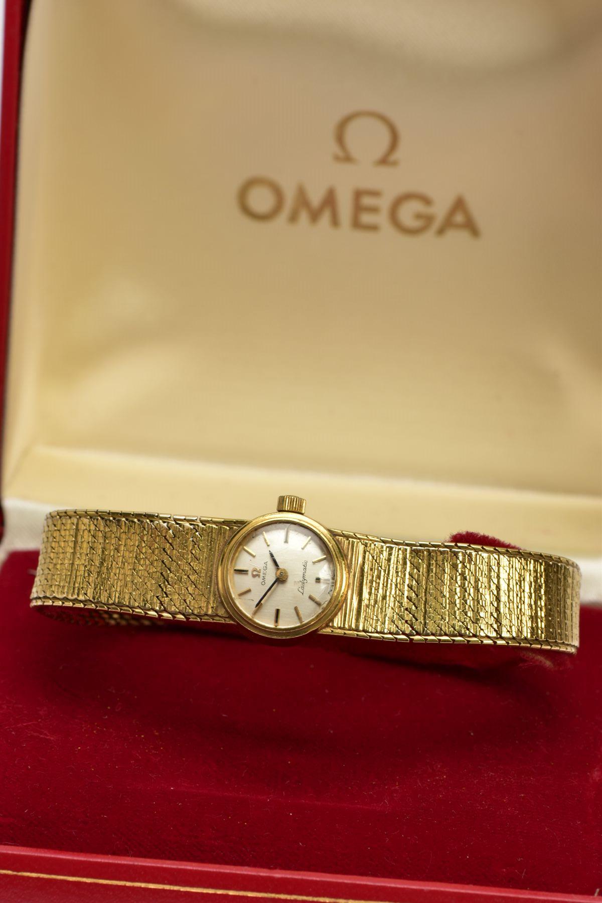 A LADIES 9CT GOLD 'OMEGA' WRISTWATCH, a hand wound movement, round silver tone dial signed 'Omega - Bild 6 aus 6