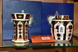 TWO PIECES OF BOXED ROYAL CROWN DERBY 1128 IMARI, comprising a ginger jar and cover, height 11cm and
