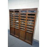 A PAIR OF EARLY 20TH CENTURY MAHOGANY HABERDASHERY CABINETS, made up of sixteen glass fronted