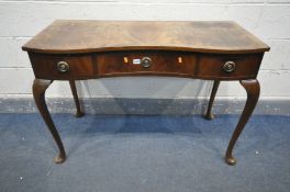 A REPRODUCTION MAHOGANY SERPENTINE SIDE TABLE with three drawers, on cabriole legs, width 109cm x