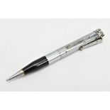 A RONSON LIGHTER PENCIL, engine turned white metal propelling pencil with a black laquear grip,