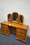 A CHERRYWOOD DRESSING TABLE with six drawers, length 147cm x depth 44cm x height 74cm, and a