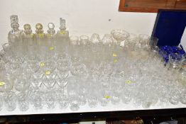 A LARGE COLLECTION OF DRINKING GLASSES, FIVE DECANTERS, A BOXED SET OF ROYAL SEFTON CRYSTAL WINE