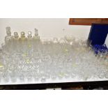 A LARGE COLLECTION OF DRINKING GLASSES, FIVE DECANTERS, A BOXED SET OF ROYAL SEFTON CRYSTAL WINE
