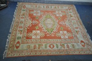 A HANDKNOTTED TURKISH KONYA CREAM AND RED RUG, 230cm x 200cm
