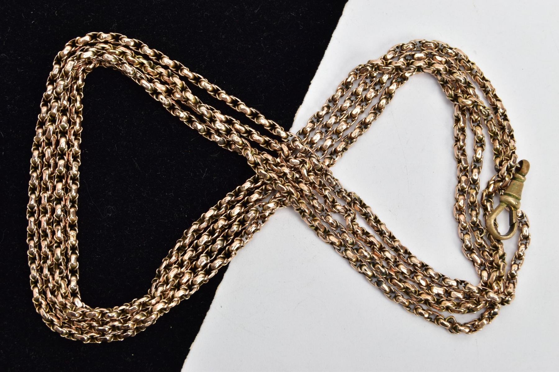 A YELLOW METAL LONGUARD CHAIN, belcher style chain, one link mounted with a '9ct' tag, fitted with a