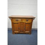AN ARTS AND CRAFTS OAK SIDEBOARD, with two drawers over double cupboard doors, width 121cm x depth