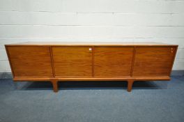 A MID-CENTURY DANISH STYLE TEAK 8FT SIDEBOARD, with four cupboard doors, enclosing four sections