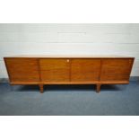 A MID-CENTURY DANISH STYLE TEAK 8FT SIDEBOARD, with four cupboard doors, enclosing four sections