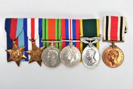 A GROUP OF FIVE MEDALS ON A WEARING BAR AS FOLLOWS, 1939-45, France & Germany Stars, Defence & War