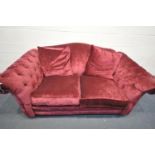 A DFS RED UPHOLSTERED SOFA, with buttoned armrests, length 204cm x depth 110cm x height 90cm