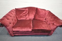 A DFS RED UPHOLSTERED SOFA, with buttoned armrests, length 204cm x depth 110cm x height 90cm