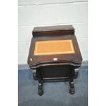 A REPRODUCTION MAHOGANY DAVENPORT, with raised back and hinged lid, tanned and tooled leather inlay,