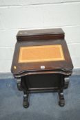 A REPRODUCTION MAHOGANY DAVENPORT, with raised back and hinged lid, tanned and tooled leather inlay,