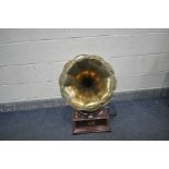 A HIS MASTERS VOICE GRAMOPHONE, with a brass horn, square base, winding handle and spare needles (