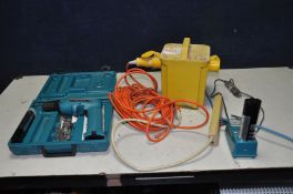 A STANDARD ELECTRICAL 110V TRANSFORMER, a Makita 6095D 9.6v drill driver with 110v charger and three