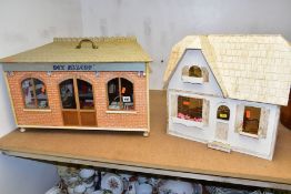 A WOODEN MODEL DRAPER'S SHOP AND DOLLS HOUSE, the draper's shop having access through the half