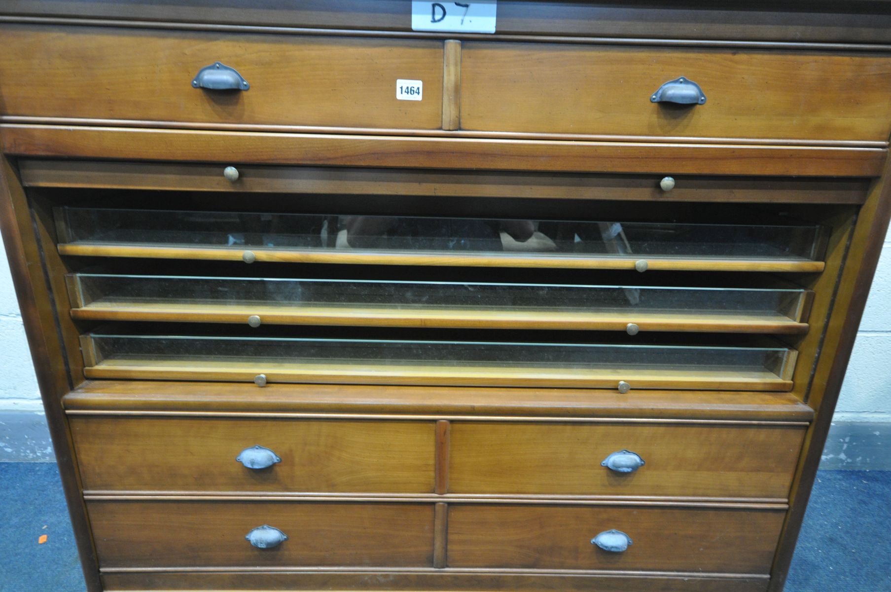 A CHERRYWOOD CABINET, with arrangement of drawers, and a central tambour door enclosing three - Bild 2 aus 3