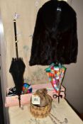 AN EMBROIDERED WALL HANGING, A FUR JACKET, A TEDDY BEAR AND PARASOLS, the wall hanging embroidered