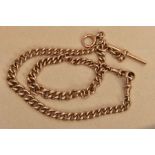 A 9CT GOLD DOUBLE ALBERT CHAIN, graduated curb link chain, each link is stamped 9.375, fitted with