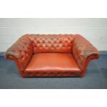 A RED LEATHER CHESTERFIELD SOFA, length 158cm (condition:-some buttons loose/missing, worn and