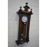 A LATE 19TH CENTURY WALNUT VIENNA WALL CLOCK, the enamel dial with roman numerals and a seconds