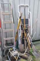 A QUANTITIY OF GARDEN EQUIPMENT, to include shovels, spades, rakes and brushes, a hozelock hose reel