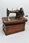 A BRADBURY'S FAMILY V.S. MANUAL SEWING MACHINE, in working condition with wooden case