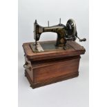 A BRADBURY'S FAMILY V.S. MANUAL SEWING MACHINE, in working condition with wooden case
