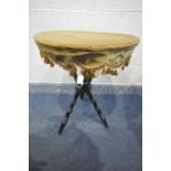 A VICTORIAN EBONISED GYPSY TABLE, the circular top with a gold fabric and tassels, on turned