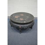 A CHINESE EBONISED CIRCULAR OCCASIONAL TABLE, with chinoiserie decoration, with folding legs,