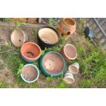 A TERRACOTTA STRAWBERRY PLANTER, along with eight various glazed planters on various sizes (9)