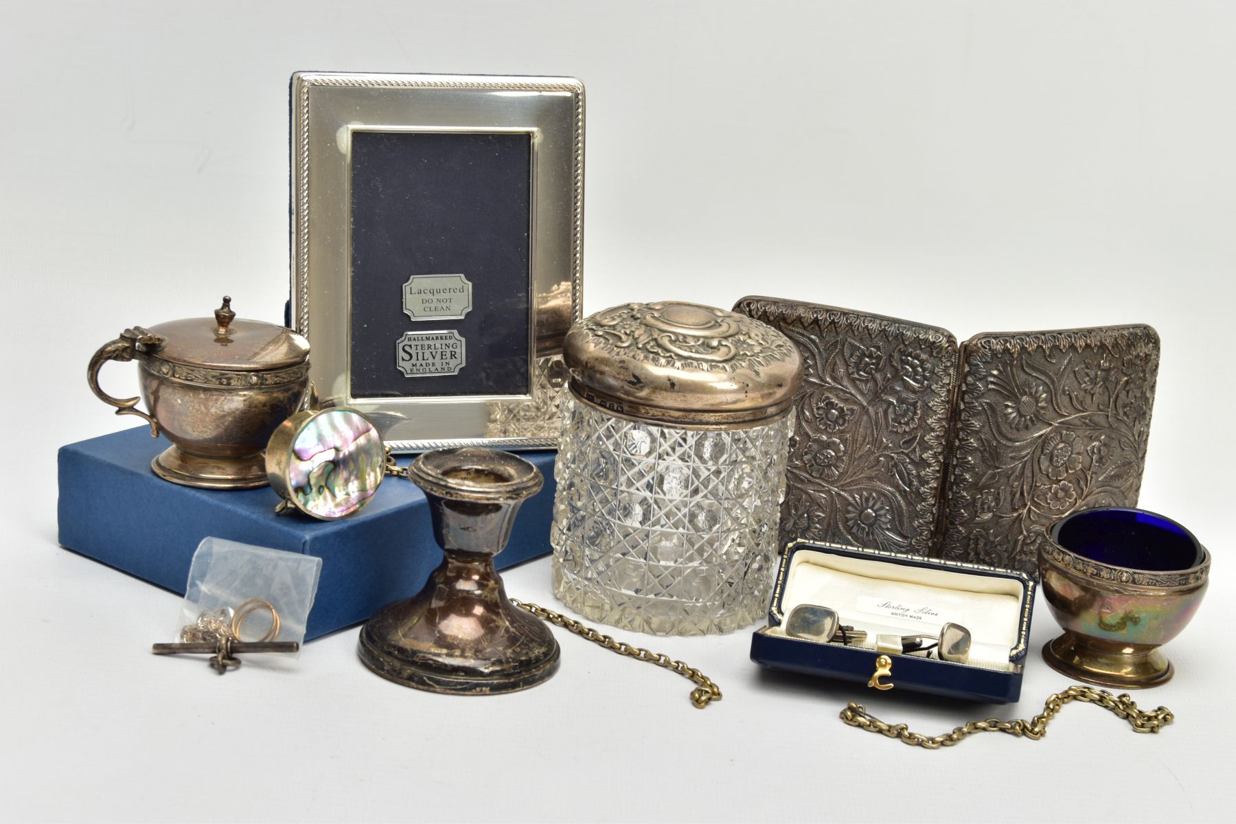 A SELECTION OF SILVER AND WHITE METAL ITEMS, to include a cut glass and silver embossed lidded