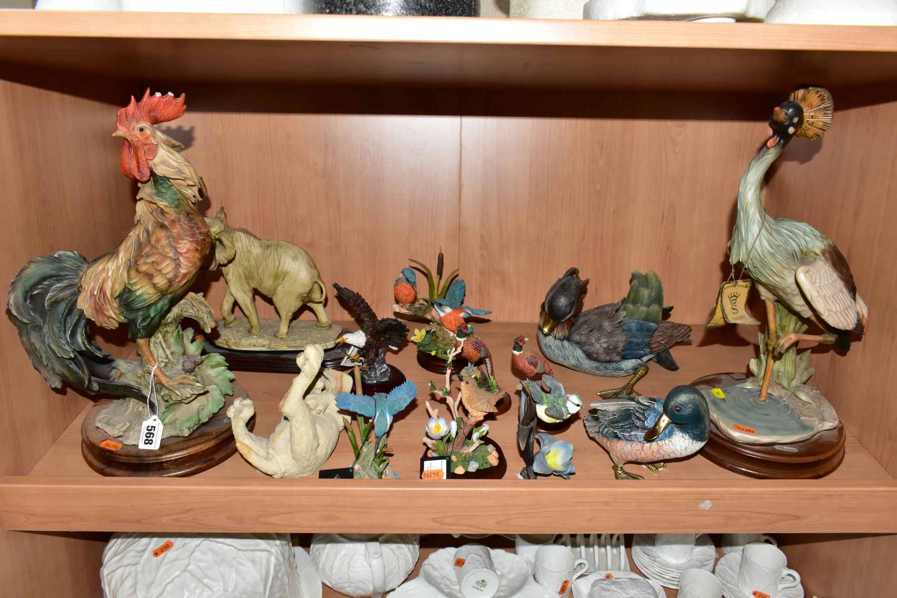 A GROUP OF RESIN BIRD AND ANIMAL FIGURES, most having wooden bases to include a Breed Apart