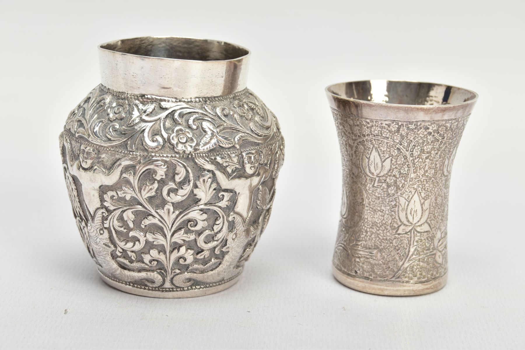 TWO WHITE METAL VASES, both of Indian design, the first decorated with raised foliate scenes, - Bild 2 aus 4