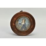 A WOODEN PORTRAIT MINIATURE, depicting a Georgian lady within a garden painting onto a tree, with
