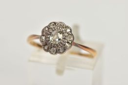 A YELLOW METAL OLD CUT DIAMOND CLUSTER RING, the old cut diamond with similar cut diamond