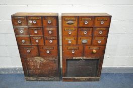 A NEAR PAIR OF EARLY 20TH CENTURY MAHOGANY APOTHECARY CABINETS, each cabinet made up of an