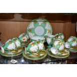 A THIRTY NINE PIECE 1930s ROYAL WORCESTER TEA SET, pattern number Z1357, with gilded flowers and