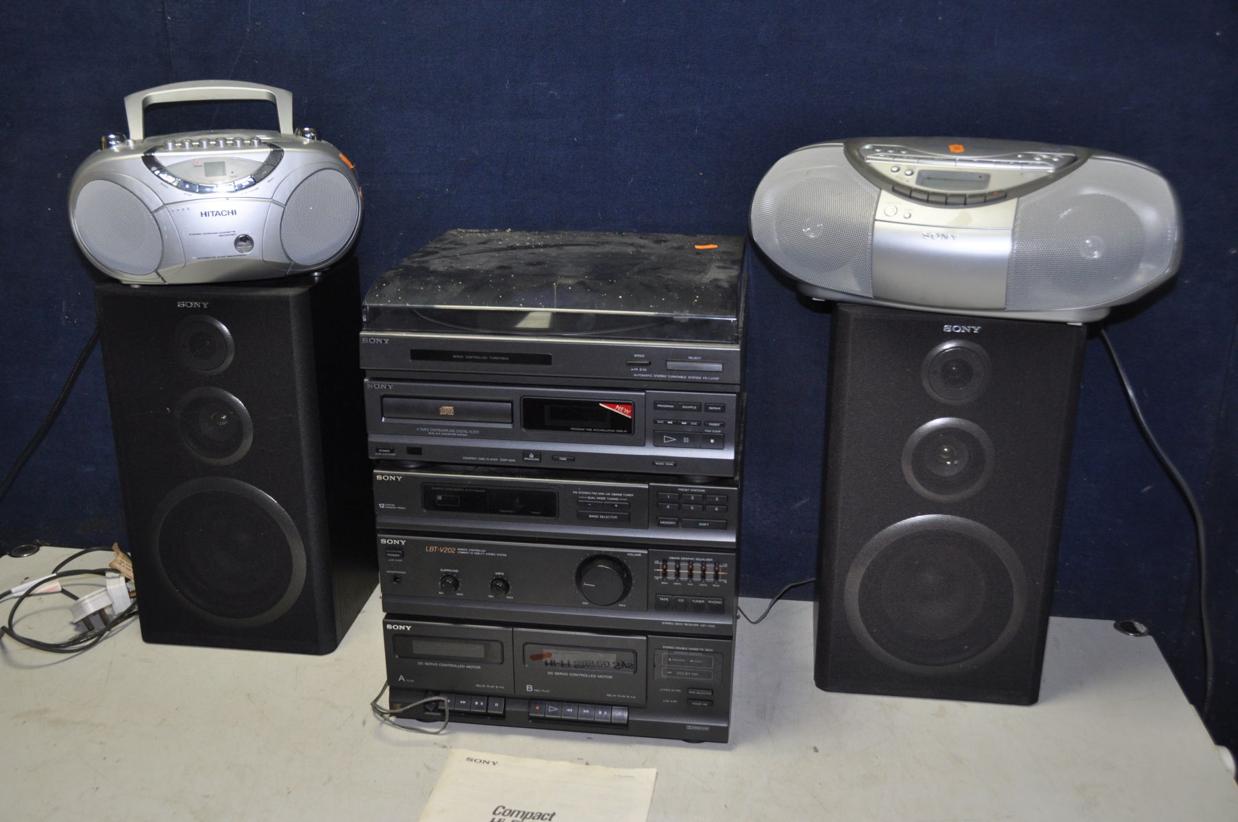 A SONY COMPACT HI-FI comprising a double cassette deck, LBT-V202, CDP-M18 cd player and a PS-LX43P