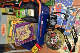 TWO BASKETS OF A CAMERA, BOOKS, TOYS AND GAMES, to include a cased Minolta Dynax 700si SLR camera