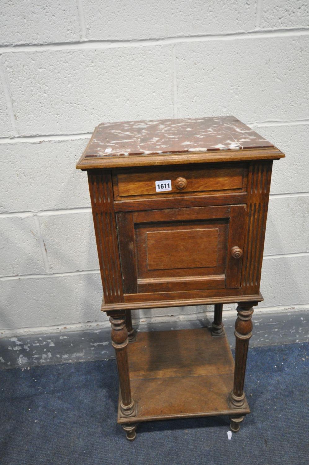 A FRENCH OAK POT CUPBOARD, with marble top, single drawer and cupboard door, and a ceramic interior,