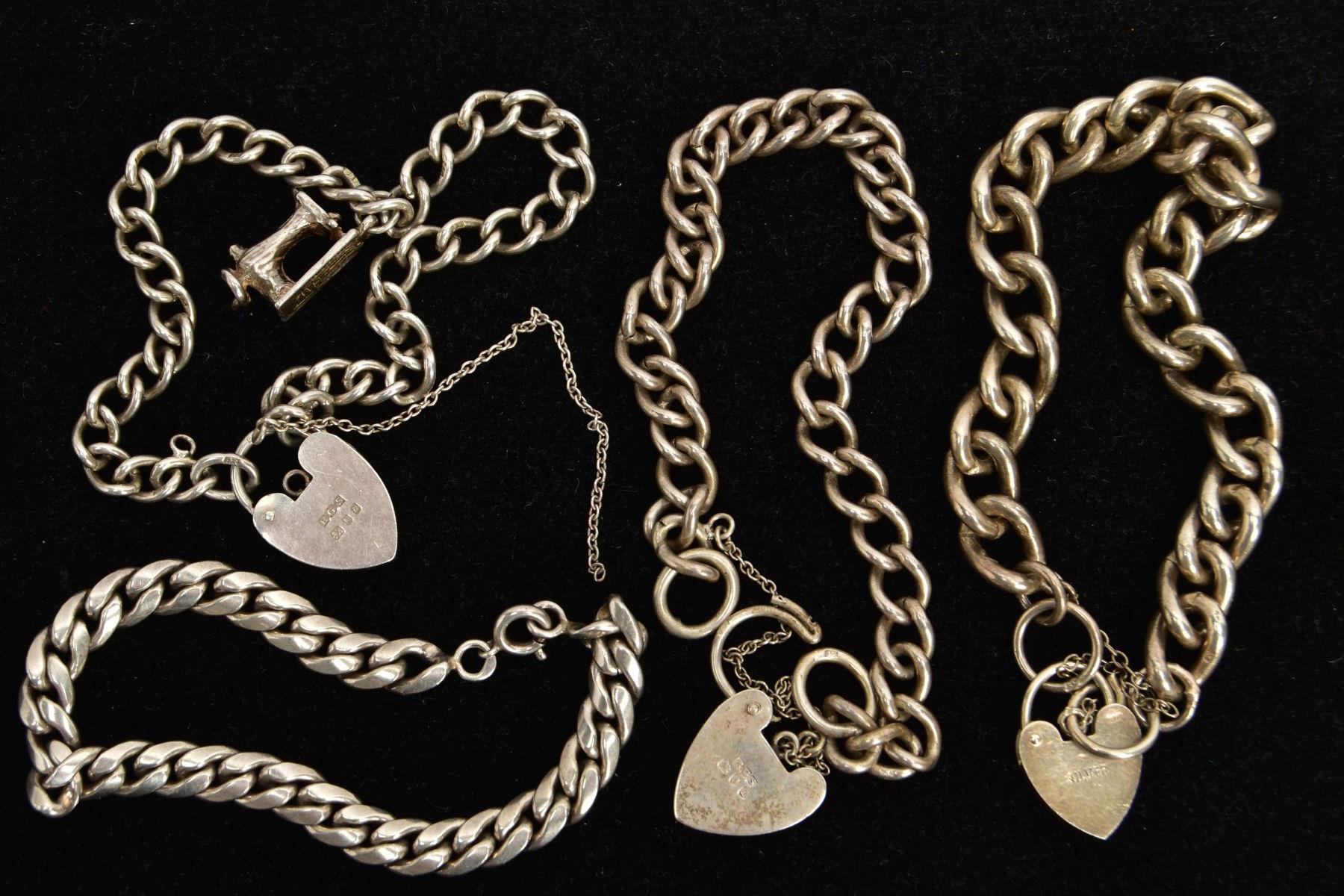 FOUR BRACELETS, to include a silver charm bracelet each link stamped with a sterling mark, fitted - Bild 2 aus 2