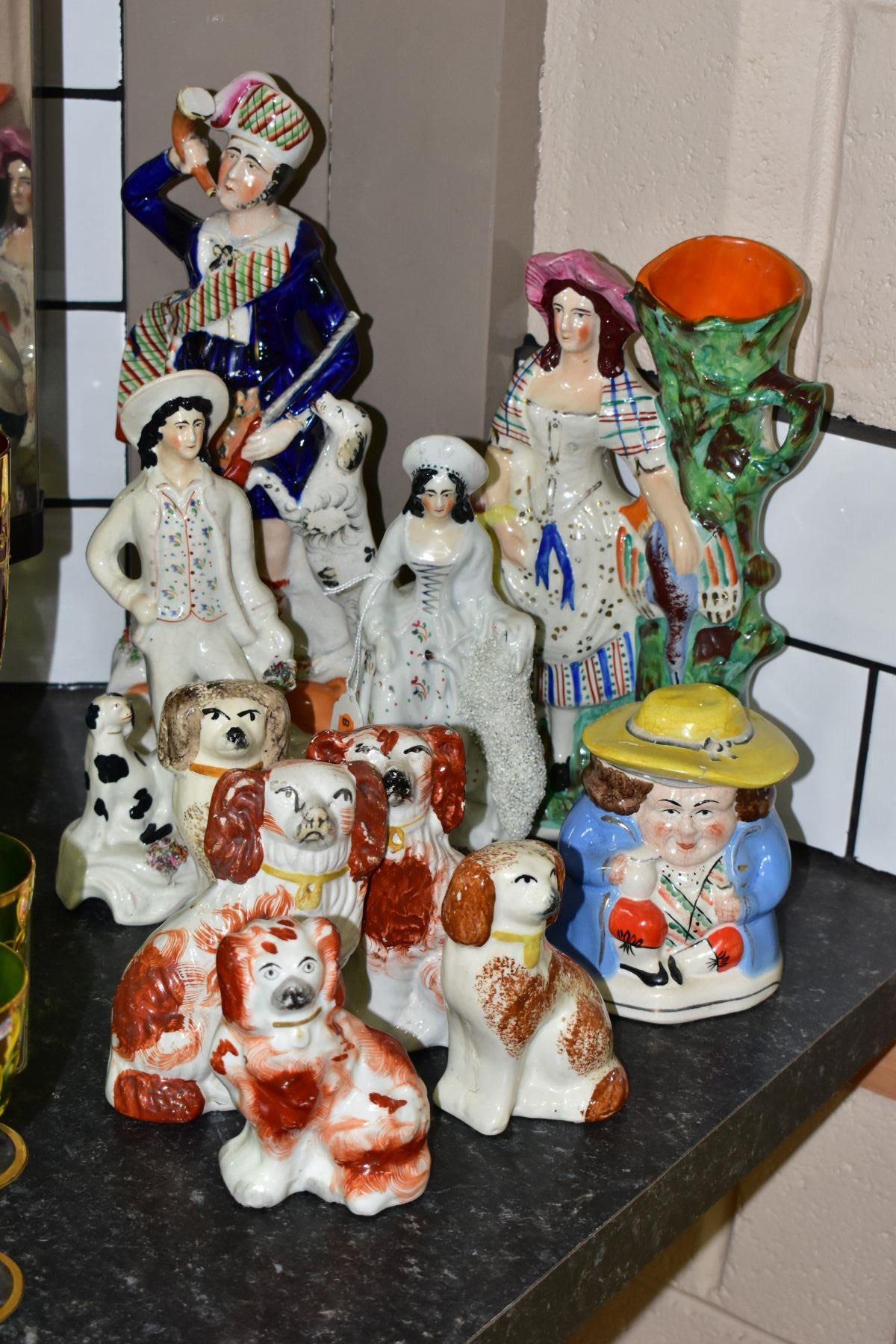 A GROUP OF STAFFORDSHIRE/STAFFORDSHIRE STYLE FLATBACK FIGURES AND SPANIELS, to include a spill