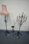 A WROUGHT IRON FIVE BRANCH STANDARD LAMP, all with small shades, with four legs, another wrought