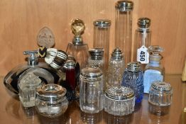 A COLLECTION OF MAINLY EARLY 20TH CENTURY GLASS SCENT BOTTLES AND SIMILAR ITEMS, many with silver