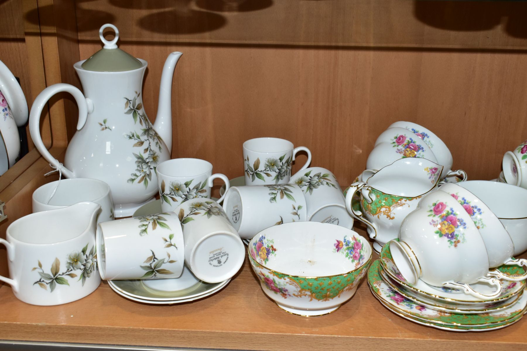 A GROUP OF TEA AND COFFEE SETS, to include a fourteen piece Paragon Rockingham tea set comprising