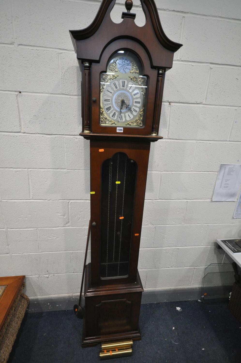 A LATE 20TH CENTURY MAHOGANY CHIMING LONGCASE CLOCK, with a tempest fugit label to arch, height