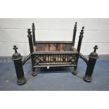 A HEAVY CAST IRON GOTHIC TYPE FIRE GRATE, flanked by andirons width 86cm x depth 55cm x height 76cm