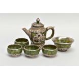 A JADE AND WHITE METAL TEA SET, of decorative oriental design, to include a tea pot with lid and